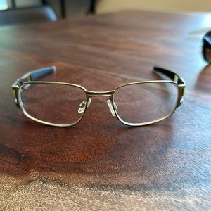 Oakley prescription eye glasses. Paper clip.